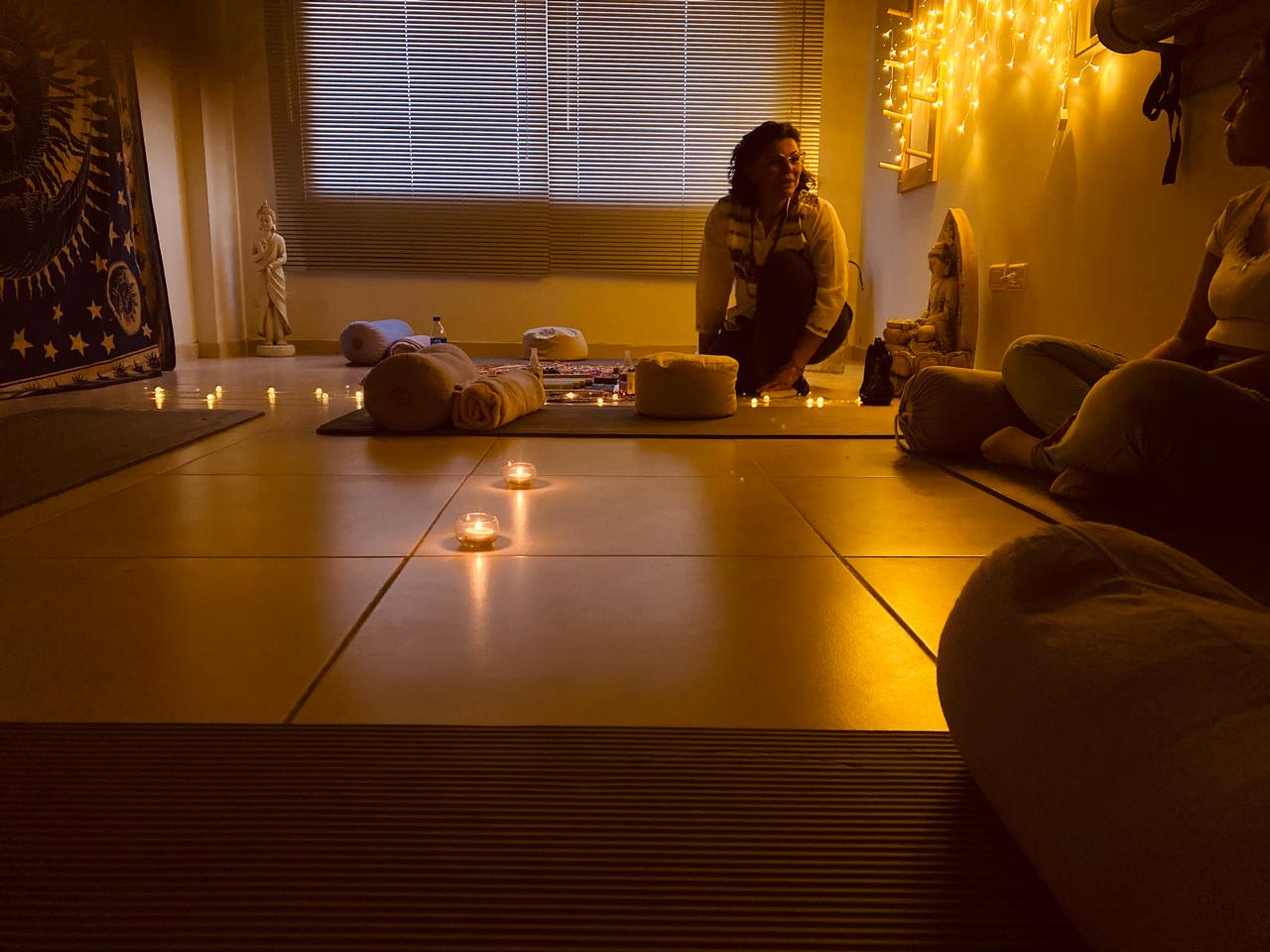 Warm candlelit meditation and massage room